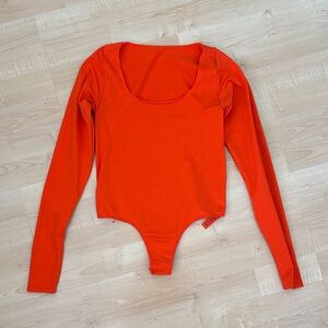 SKIMS Vibrant Orange Long Sleeve Bodysuit
